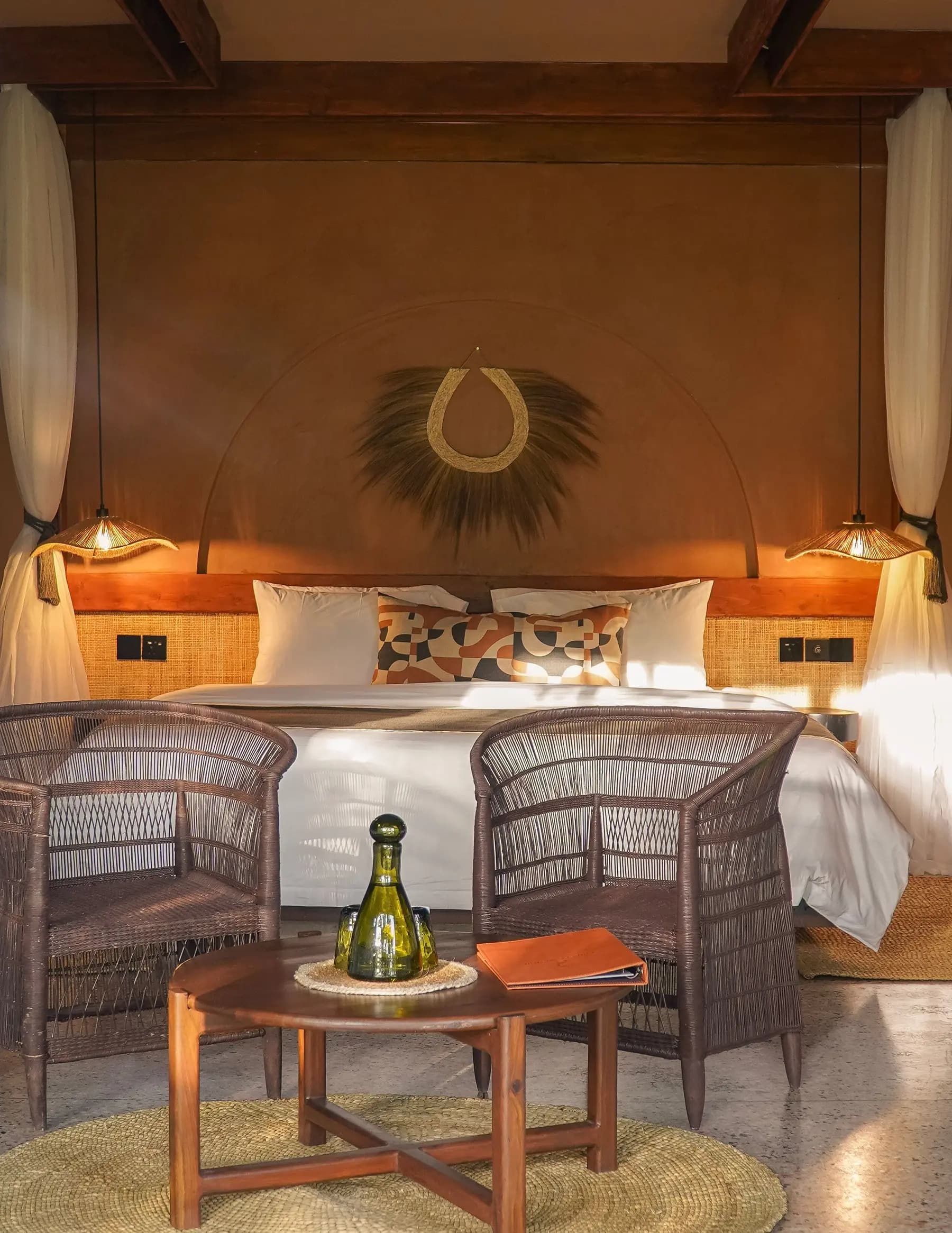 Bedroom with woven headboard and warm lighting