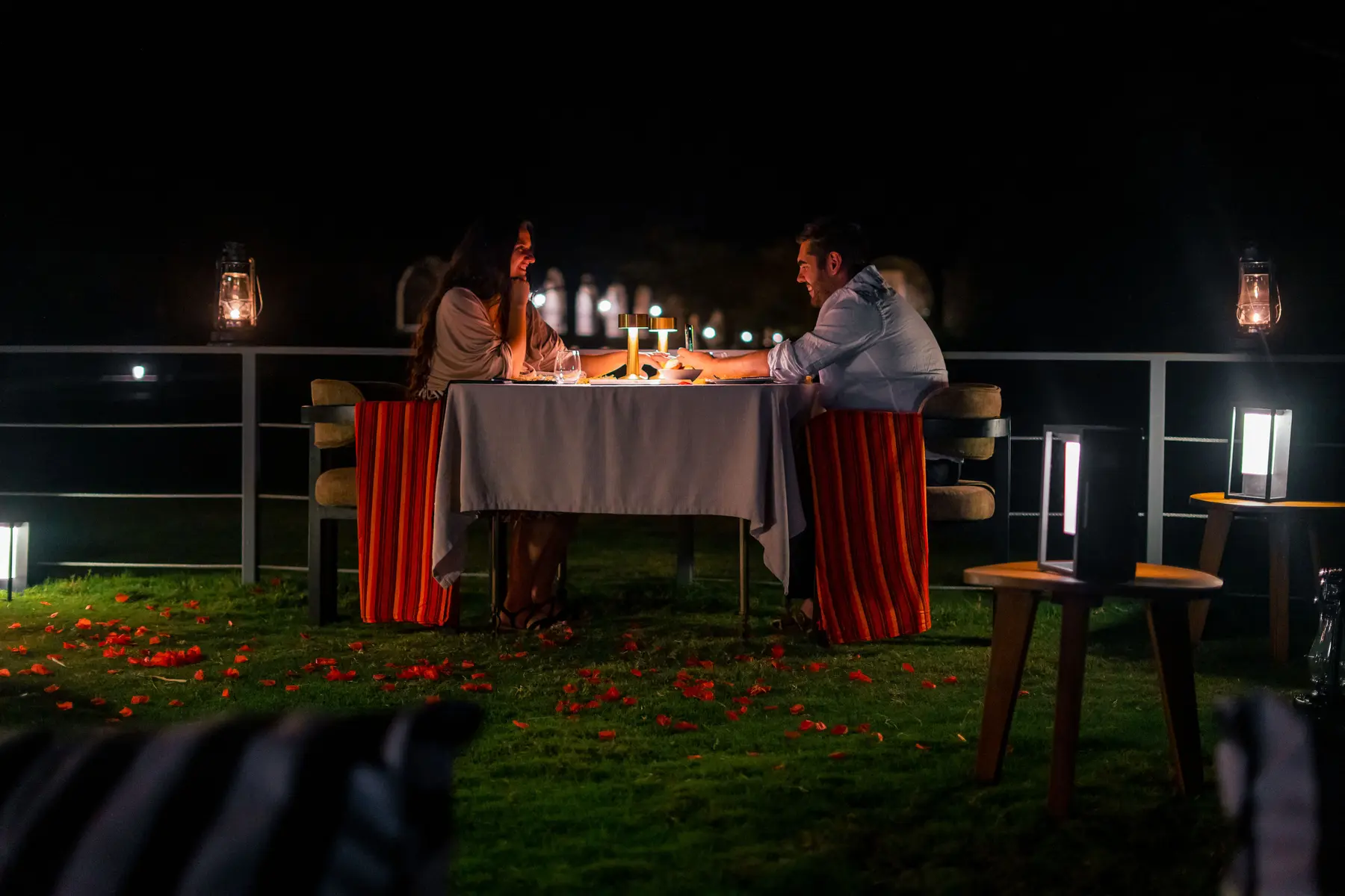 Candlelit private dinner on the lawn at night
