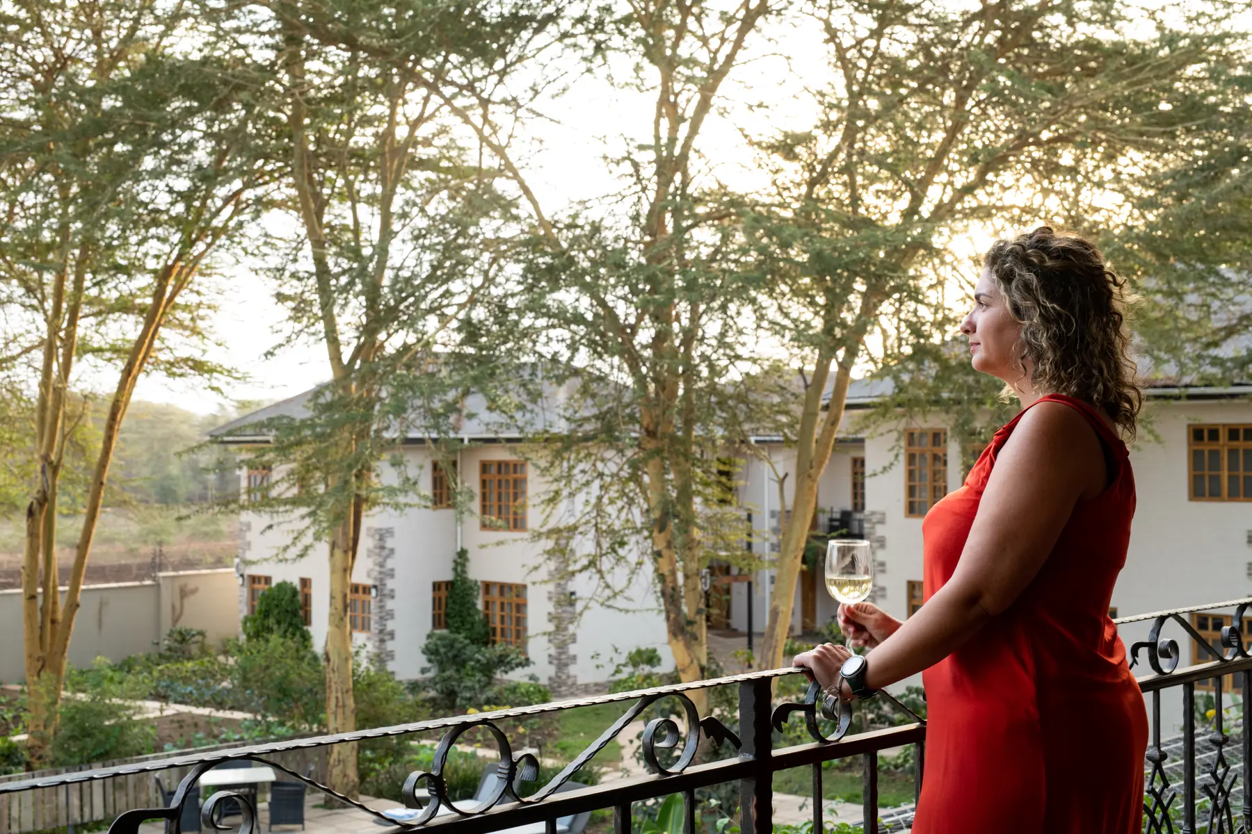 A guest on her balcony above the gardens