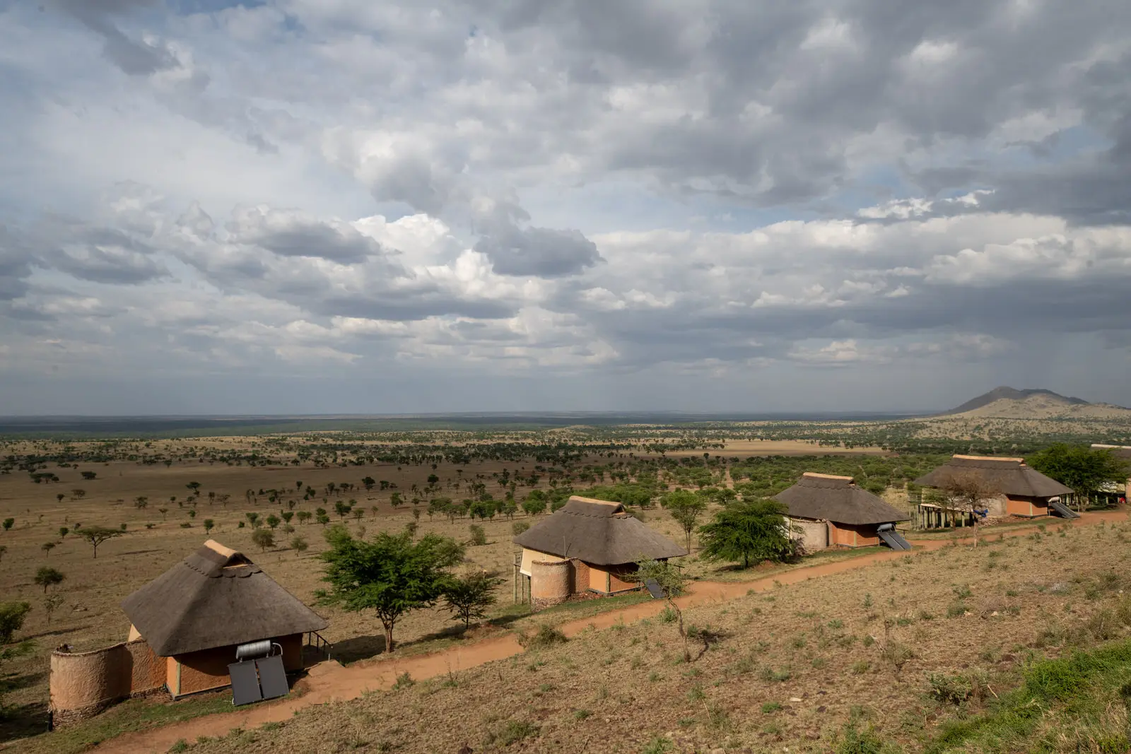 Thatched tents spread across the hillside