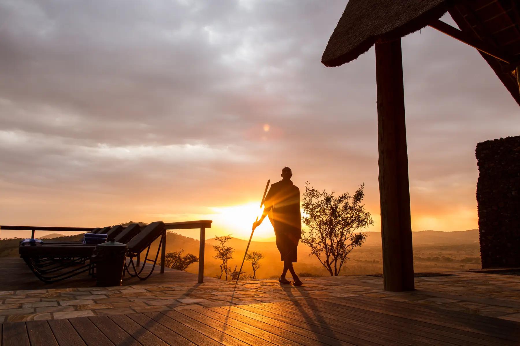 Maasai guide at sundowner on the deck